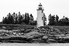 Remote Franklin Island Light Tower Over Rocky Shore -BW